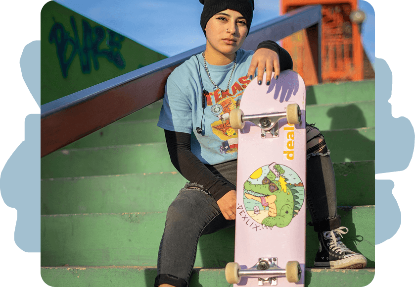 Skateboarder sitting on stairs